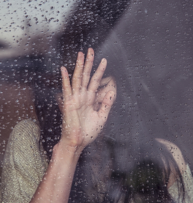 Blog Post Picture 10.17.19 Sad Woman Leaning on a Glass Window